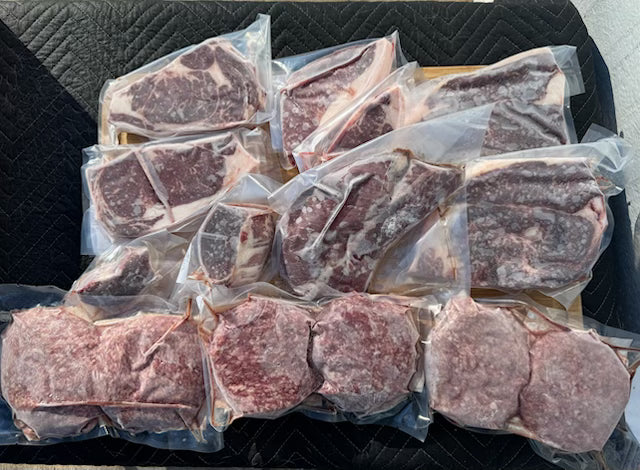 Packaged raw beef on a black surface