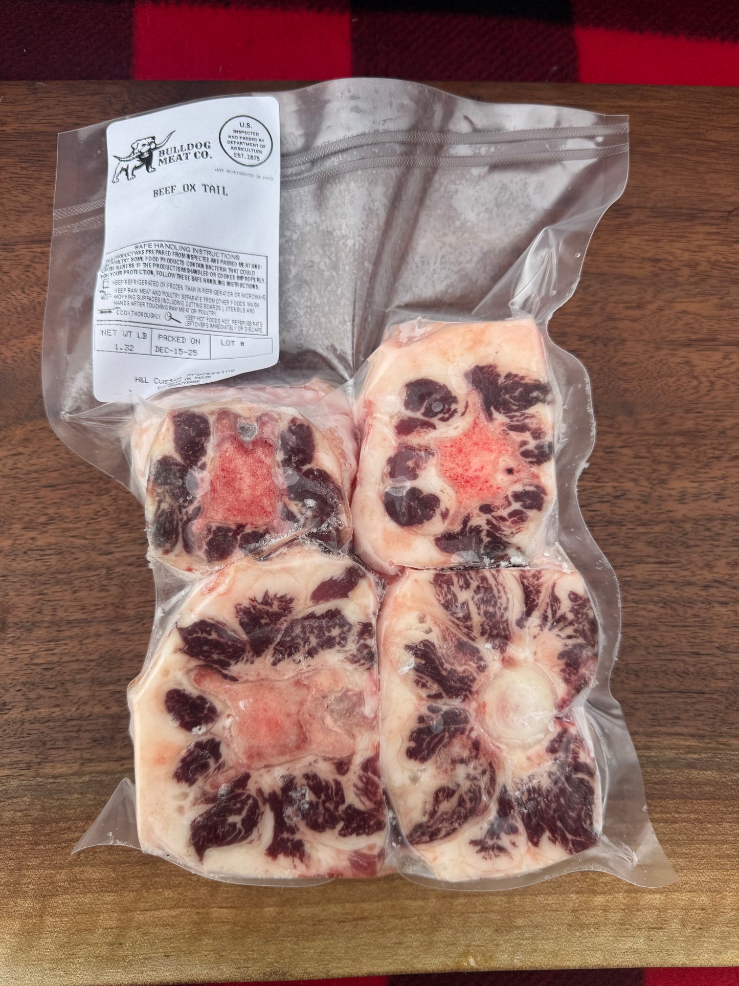 Packaged meat with visible label on a wooden surface