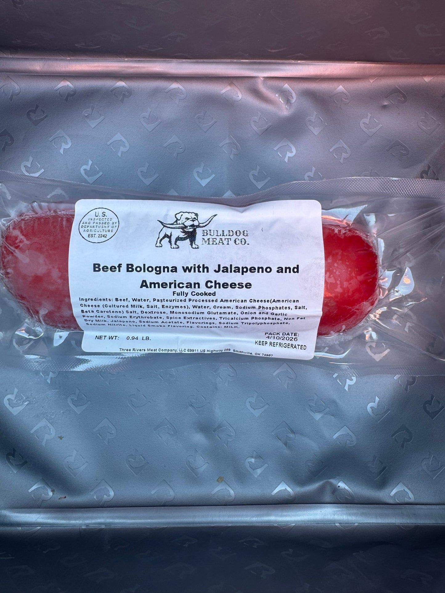 Beef bologna with jalapeno and American cheese packaging on a branded tray.