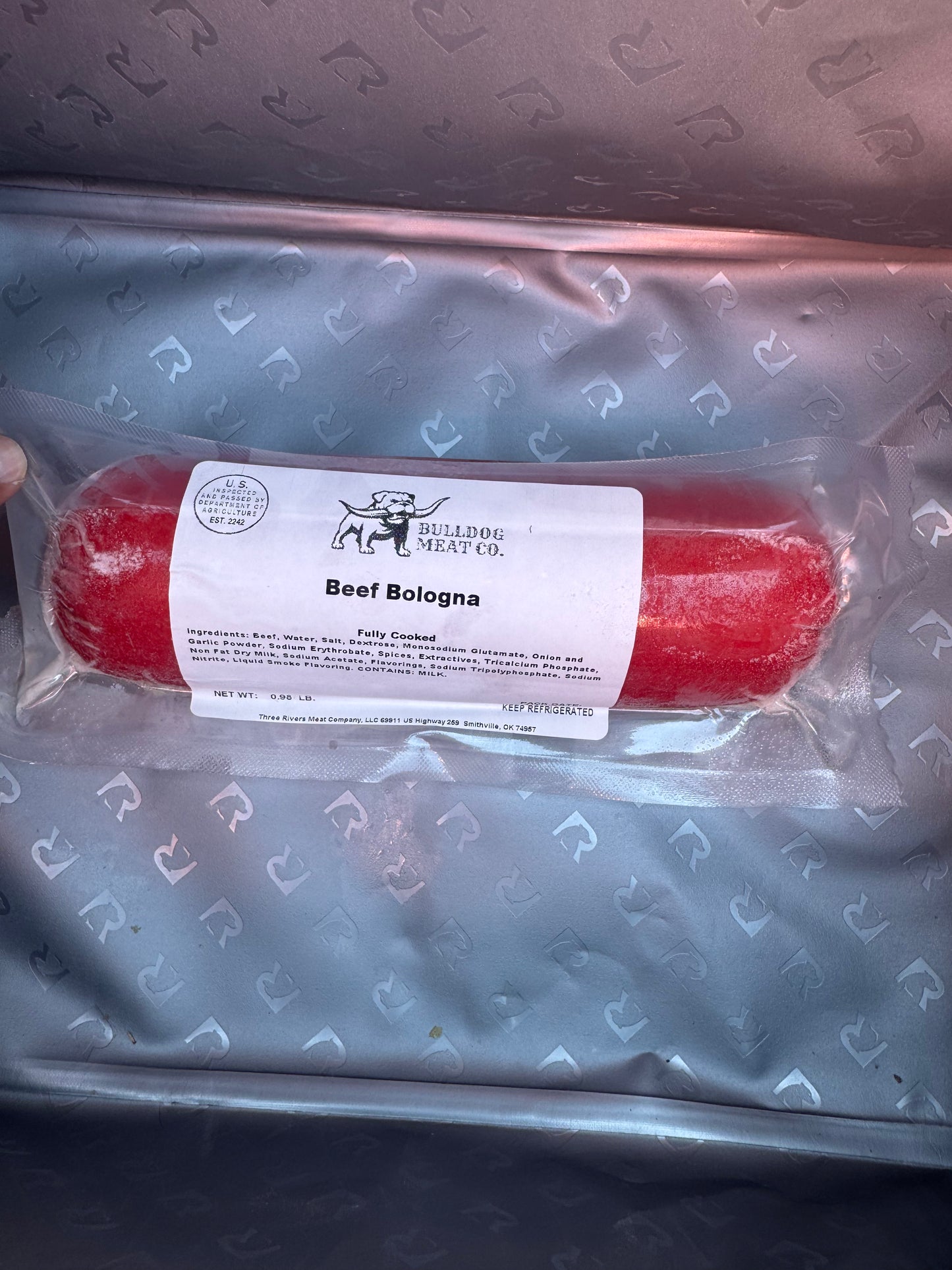 Packaged beef bologna with a label on a branded tray