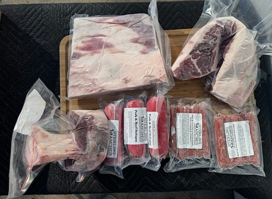 Packaged raw meat on a cutting board with visible labels.