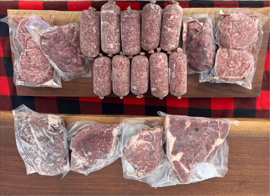 Assorted packaged meats on a wooden board with a red checkered tablecloth background
